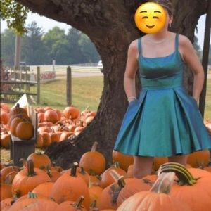 Size 9 from David’s Bridal 
Blondie Nites by Stacy Sklar
Worn once , color teal